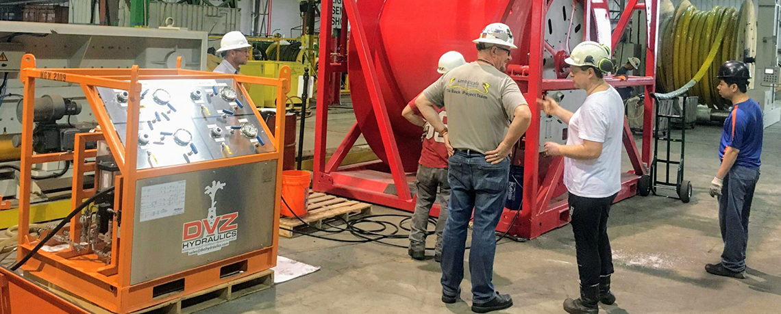 onsite photo of men doing Hydraulic Fluid Analysis Services